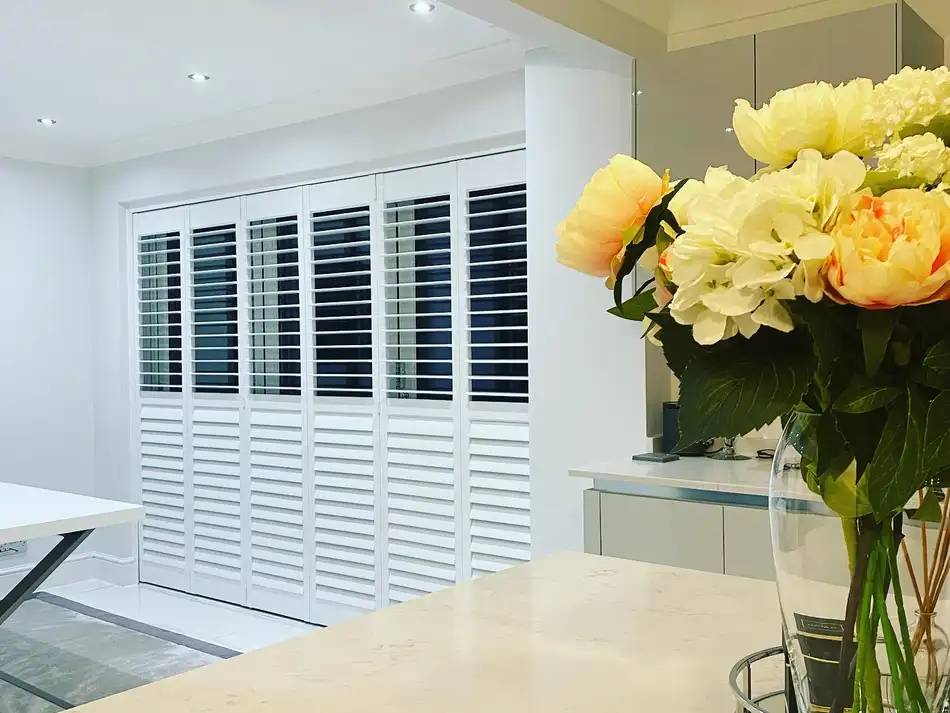 Full-height shutters running along a kitchen diner
