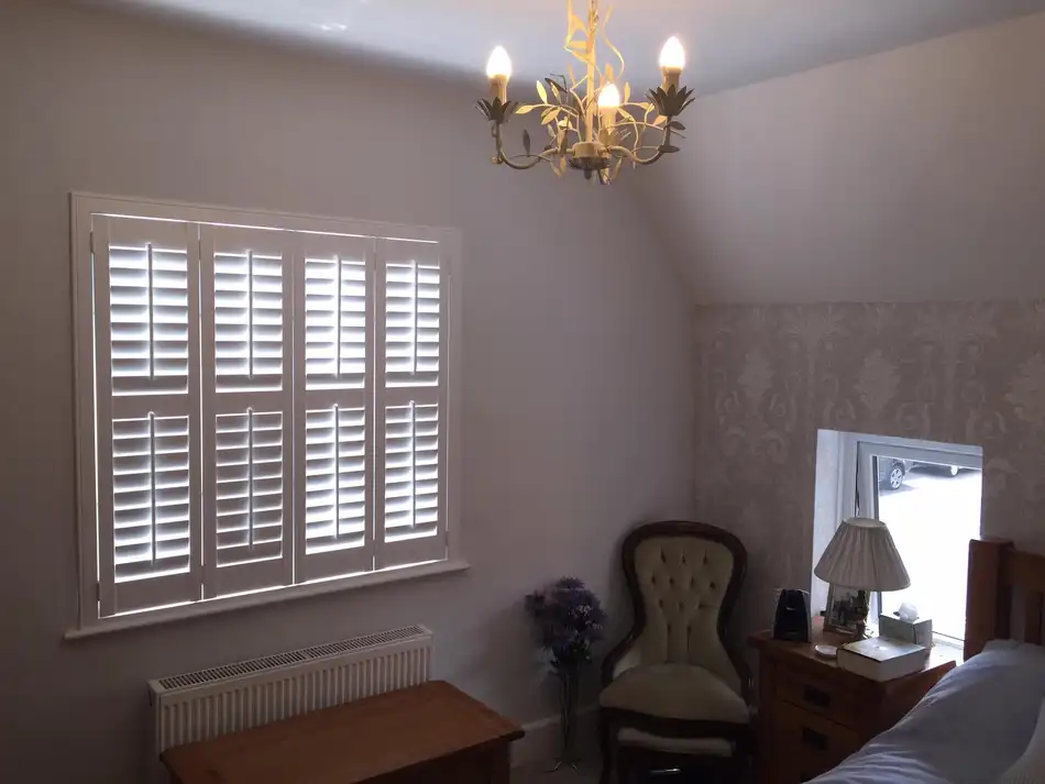 Shutters dressing a period Essex home with chandelier